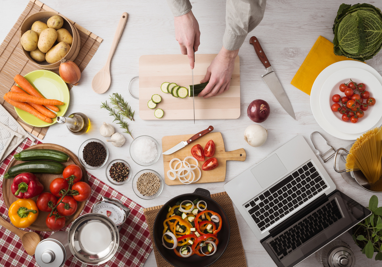 Man cooking with laptop